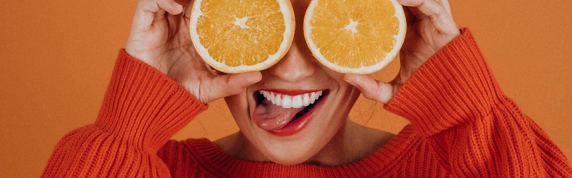 smiling with an orange